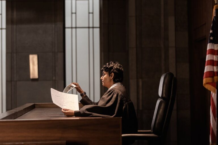 a judge reviewing evidence in court 1 768x512